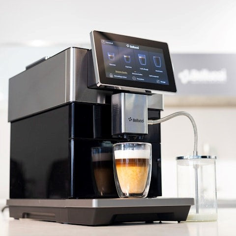 Bistro Casa coffee machine with a cup of coffee on a white countertop.