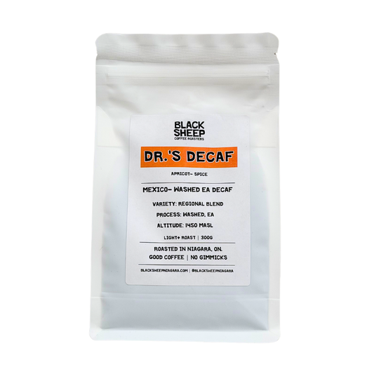 A white stand-up pouch of Black Sheep Coffee Roasters Dr.'s Decaf Espresso, featuring a white label with an orange accent bar and black text, set against a plain white background.