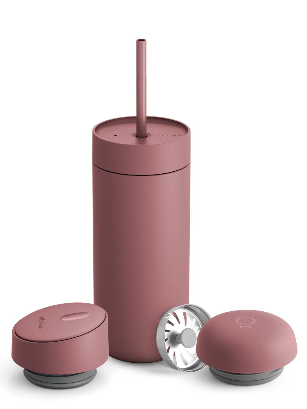 Pink tumbler with multiple lids on a white background
