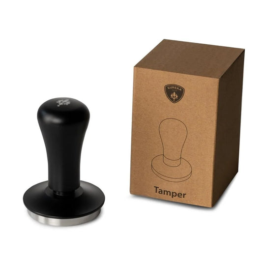 Black coffee tamper with a brown box labeled 'Tamper' on a white background