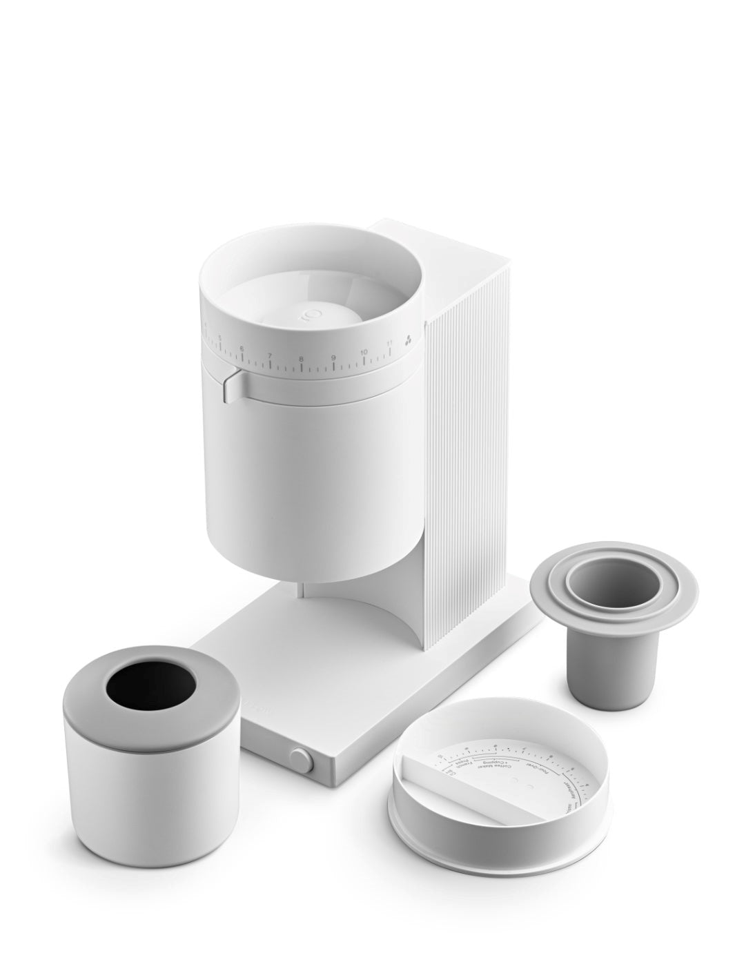 White Fellow Opus coffee grinder with accessory dosing cups and lid on a white background
