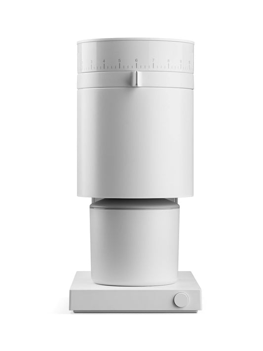 White coffee grinder with a dosing bin on a white grinder