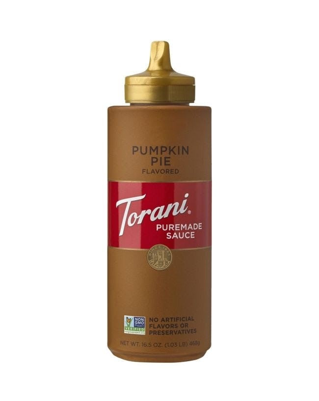 A bottle of Torani Pumpkin Pie Sauce with a brown label and a golden cap.