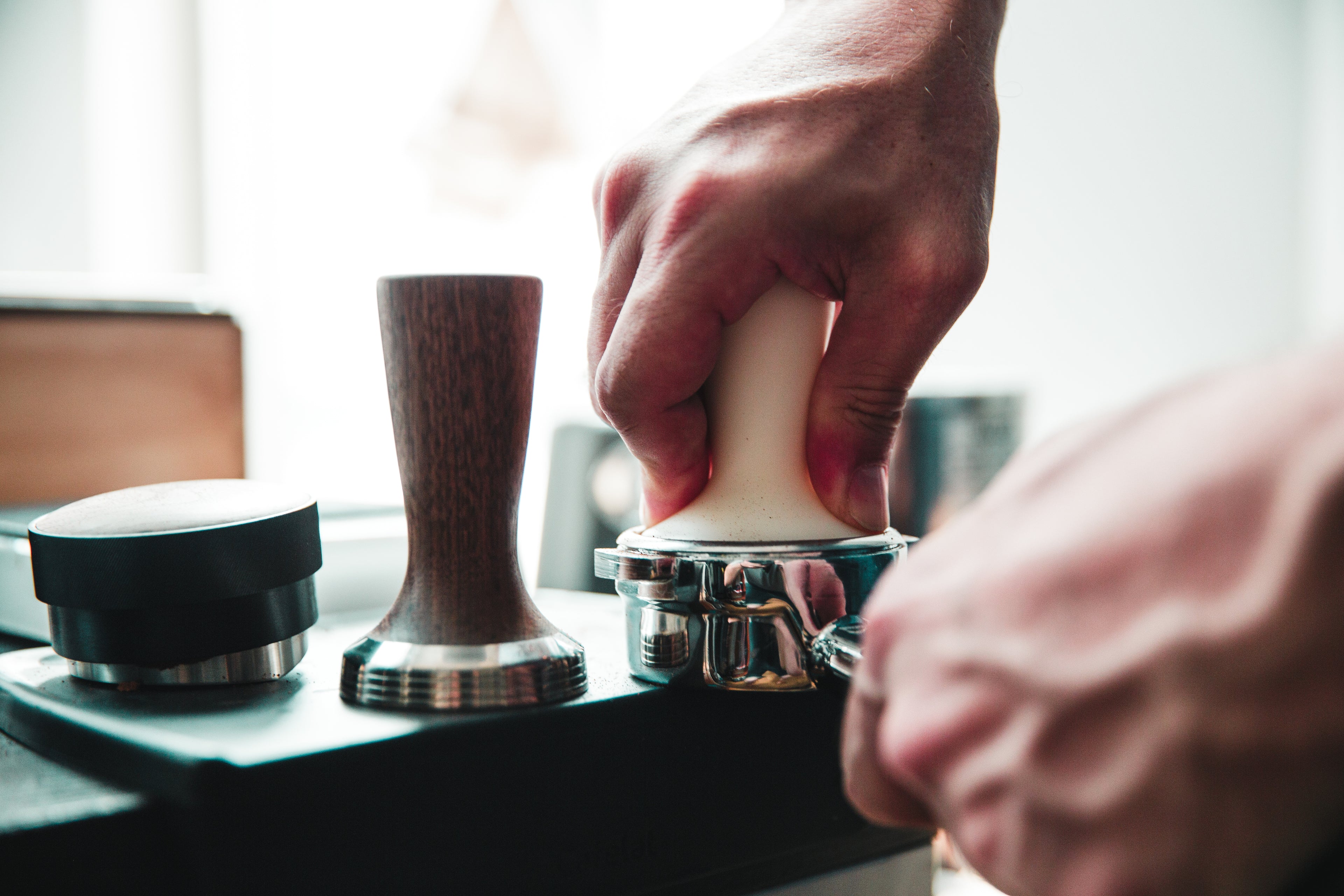 tamper-being_pressed-into-espresso-machine-wand