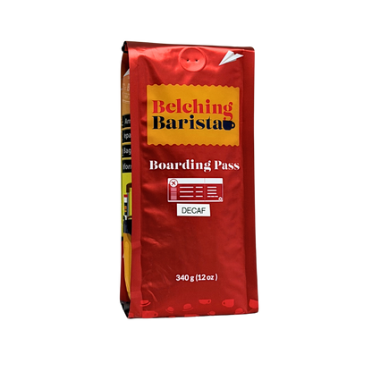A 340 g bag of Belching Barista Boarding Pass Decaf coffee, featuring a metallic red packaging design with a yellow label and white text, isolated on a white background.