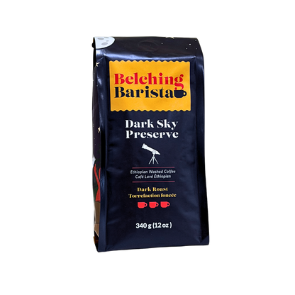 A 340 g bag of Belching Barista Dark Sky Preserve coffee, featuring a dark navy blue bag with a yellow logo banner and white text, set against a plain white background.