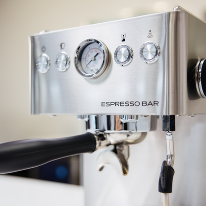 Espresso machine with control panel and 'Espresso Bar' branding.