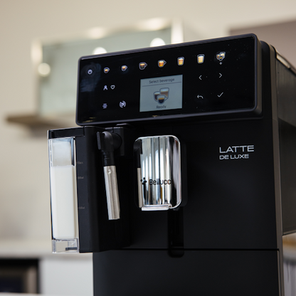 Black coffee machine with digital display and Bellucci branding in a kitchen setting