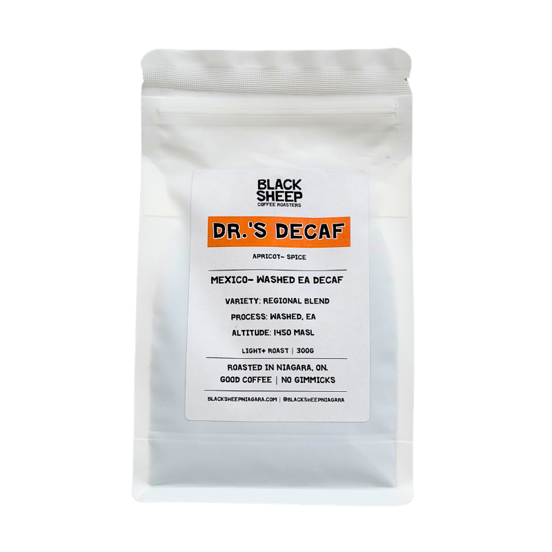 A white stand-up pouch of Black Sheep Coffee Roasters Dr.'s Decaf Espresso, featuring a white label with an orange accent bar and black text, set against a plain white background.