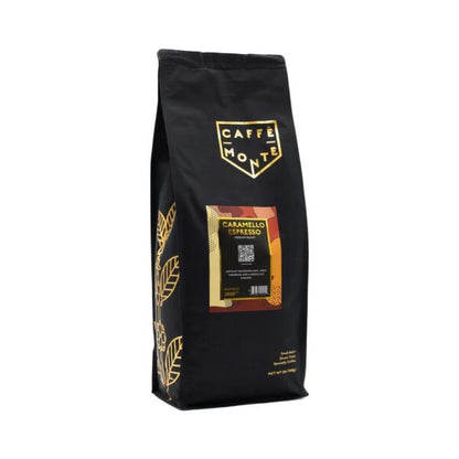 A black bag of Caffe Monte Caramello Espresso coffee with gold leaf accents and a gold shield logo, shown on a plain white background.
