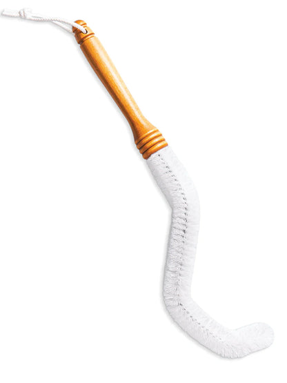 White cleaning brush with a wooden handle on a white background