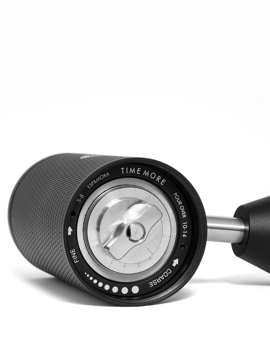 Close-up of a coffee grinding device with 'Time More' branding on a white background