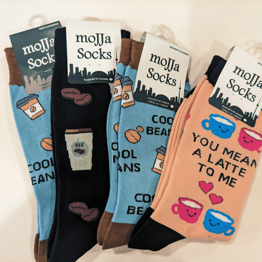 Collection of mojja Socks with coffee-themed designs on a white background