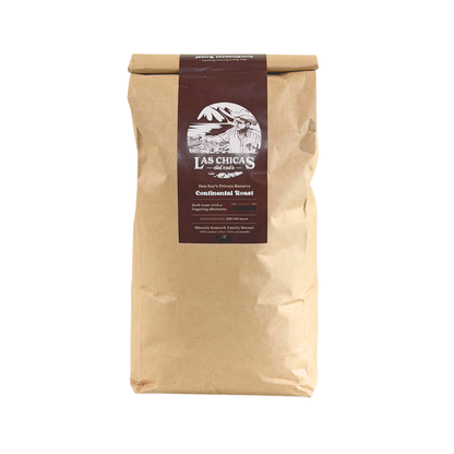 A brown kraft paper bag of Las Chicas Coffee Roasters Continental Roast, featuring a dark brown label with white text and graphics, set against a plain white background.