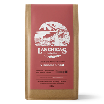 A 340g bag of Las Chicas del cafe Viennese Roast coffee in a brown kraft paper bag with a prominent dusty red label.