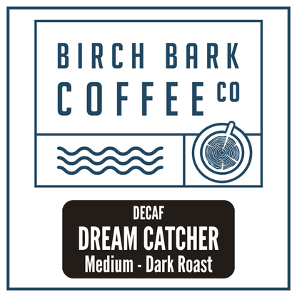 A square coffee label design for Birch Bark Coffee Co. featuring the brand name in dark blue text at the top, simple blue line icons below, and a black label at the bottom reading 'DECAF DREAM CATCHER Medium - Dark Roast' in white text.
