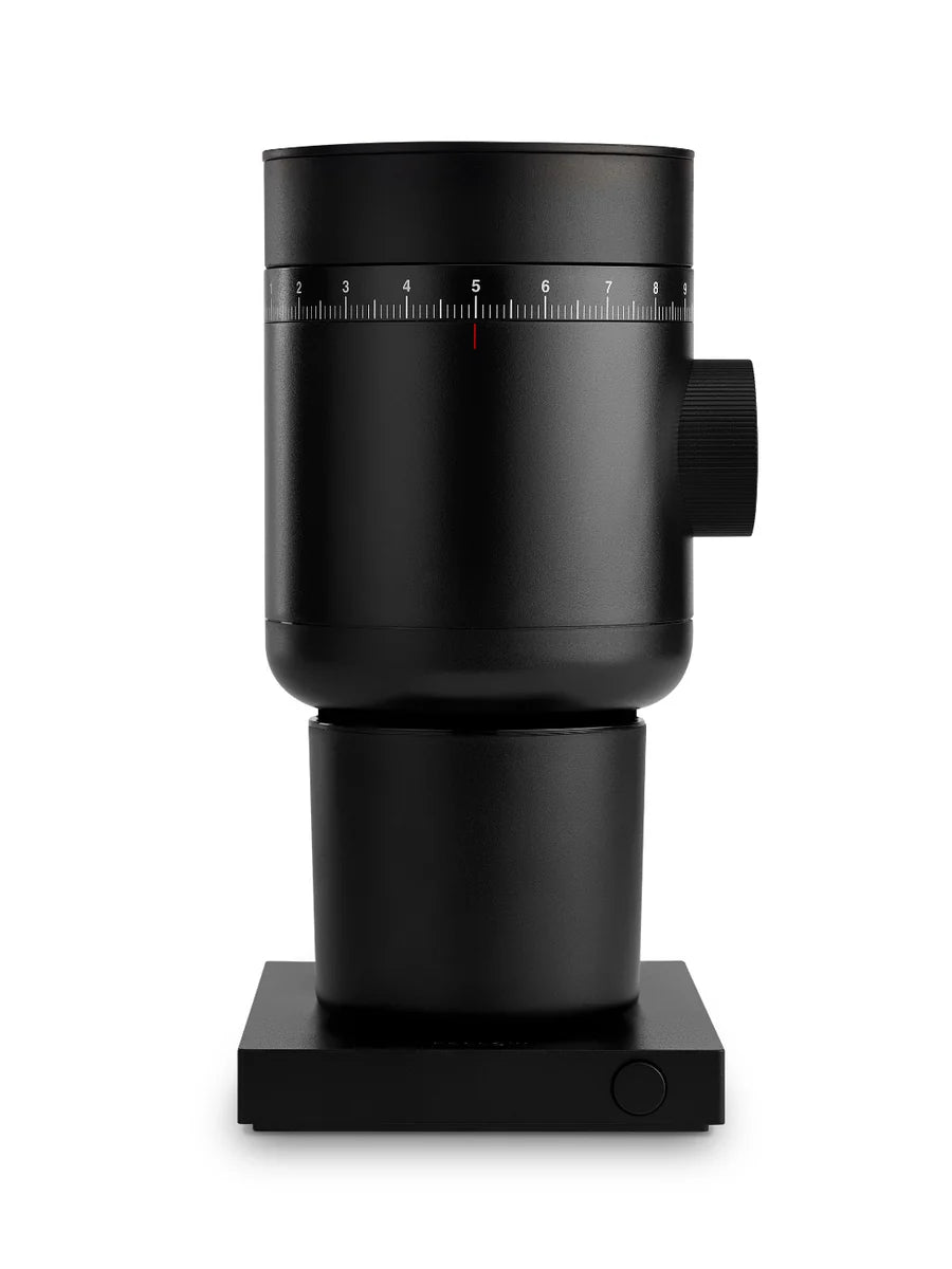 Black coffee grinder on a white background