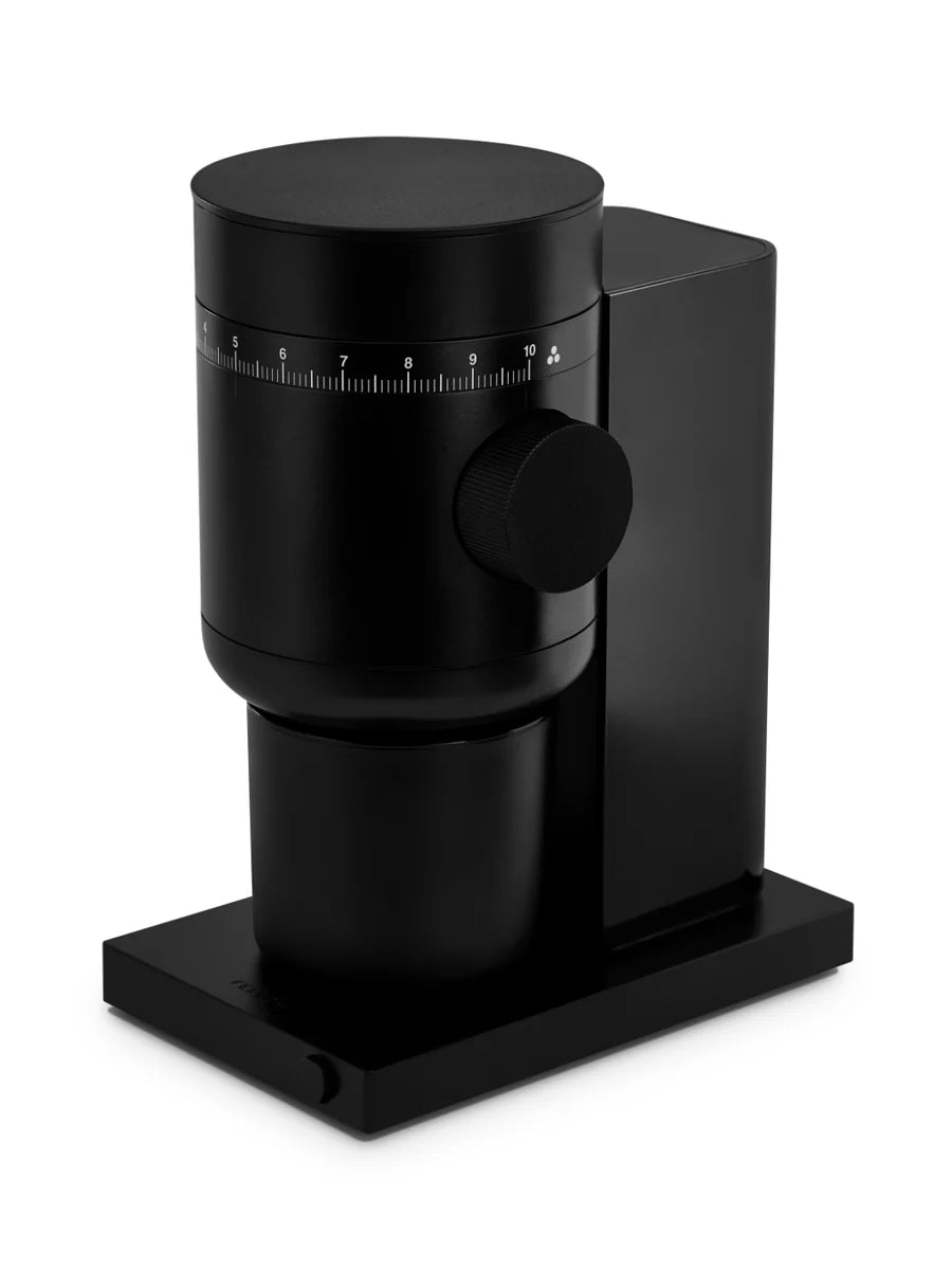 Black coffee grinder on a white background