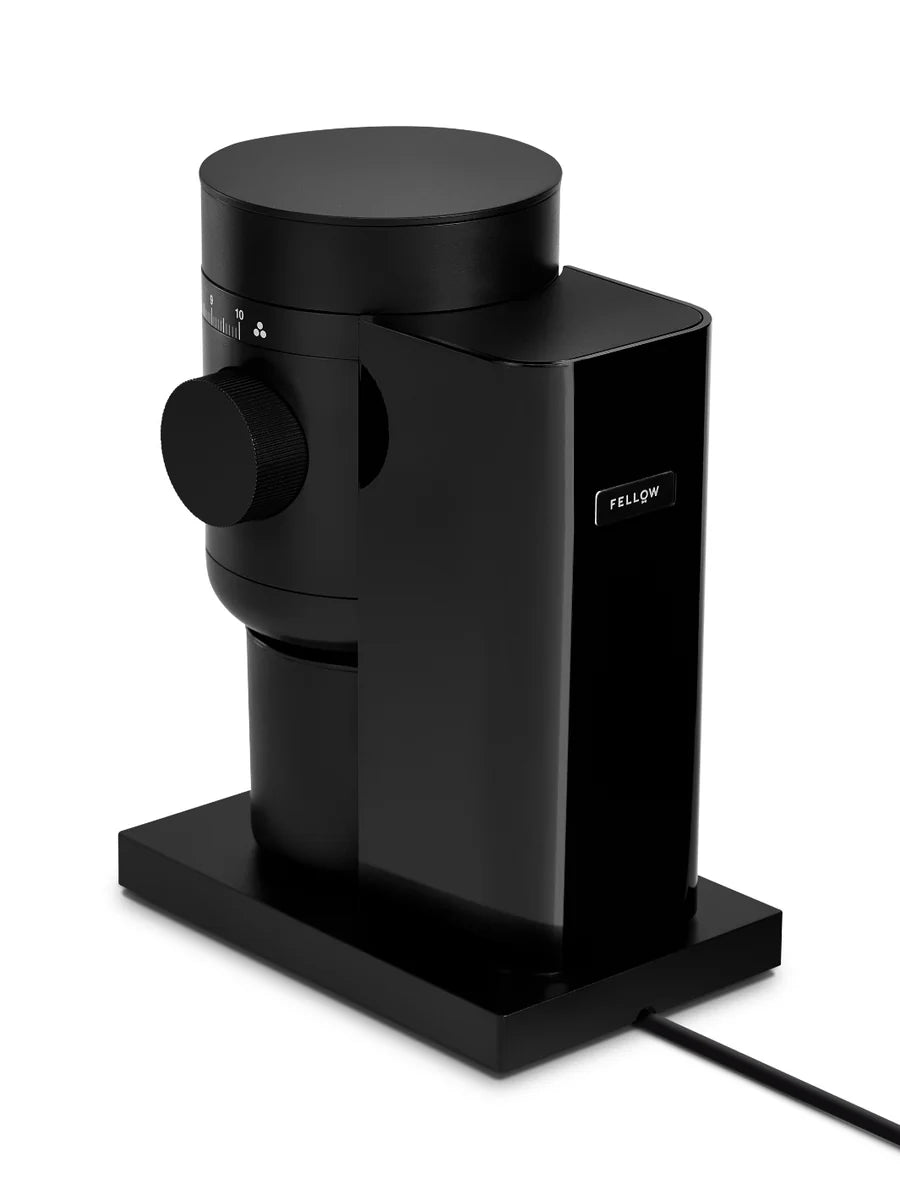 Black coffee grinder with 'Fellow' branding on a white background