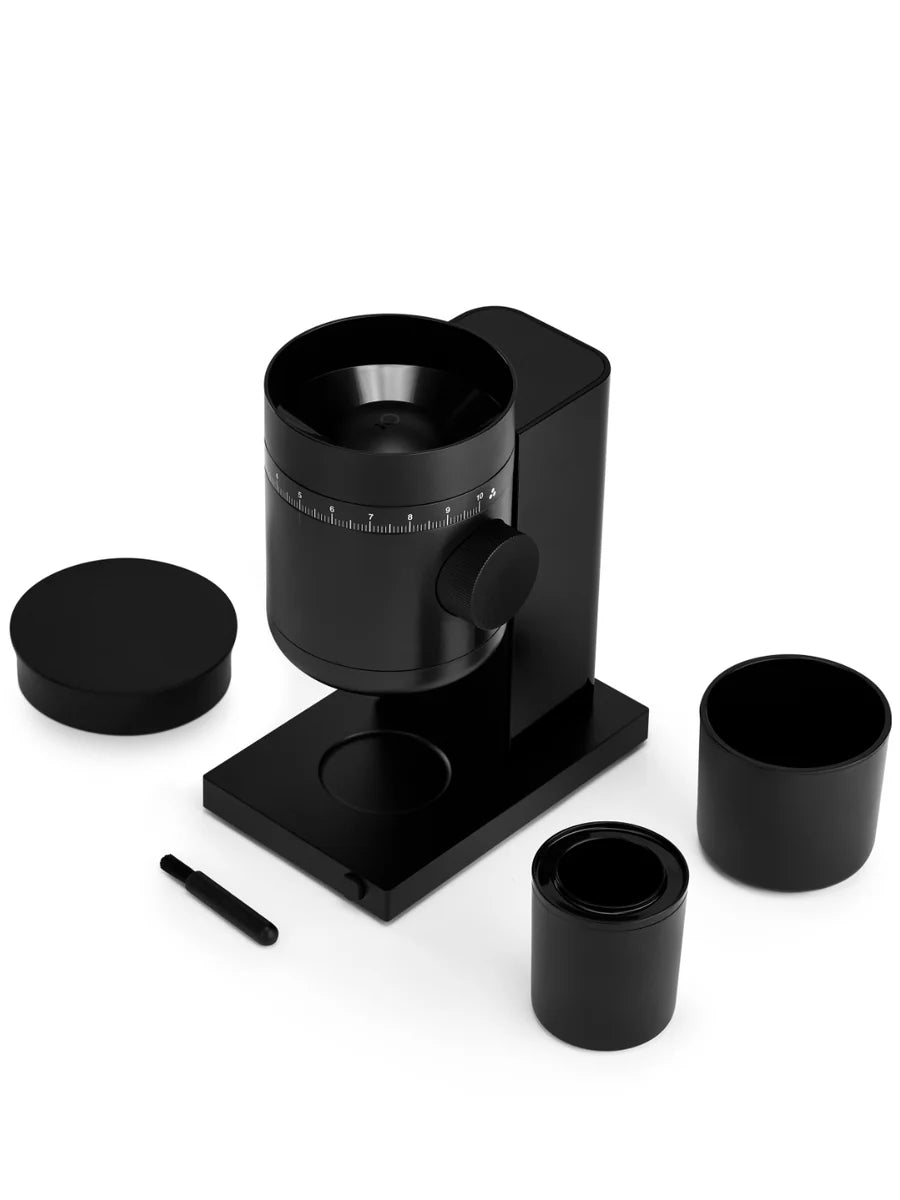 Black coffee grinder with attachments on a white background