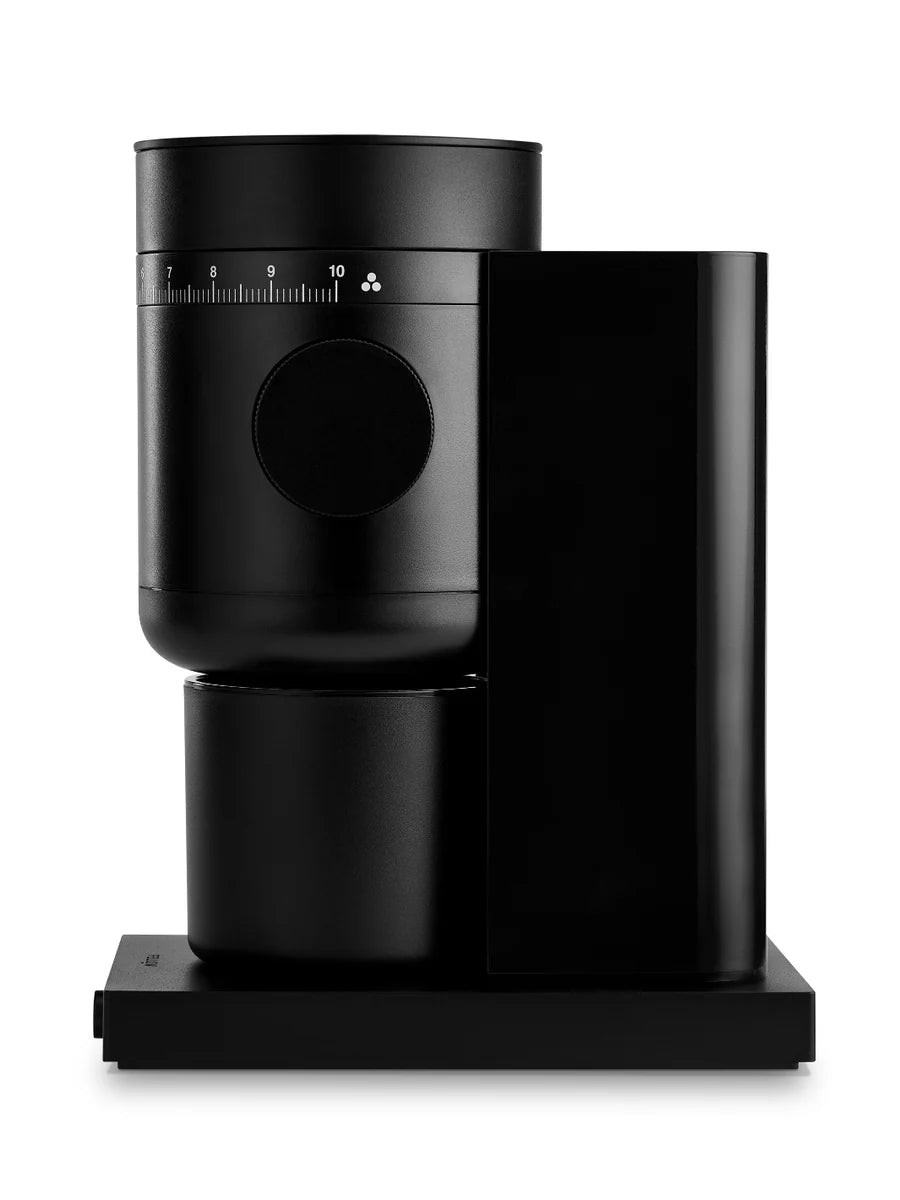 Black coffee grinder turned to the side on a white background