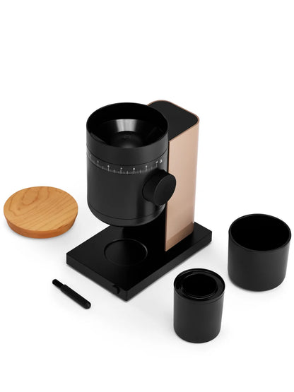Black coffee maker with wooden lid and two black cups on a white background
