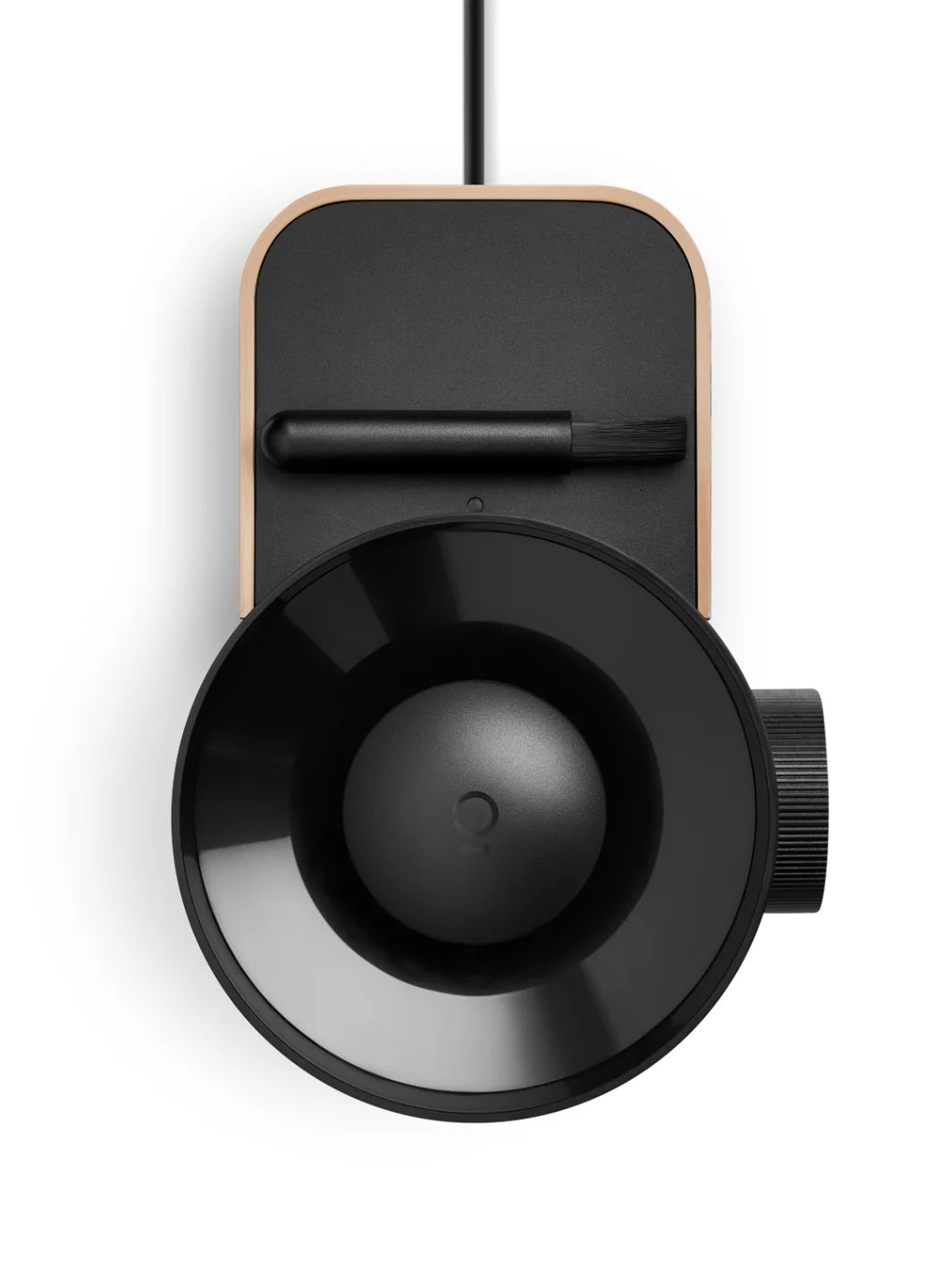 Black cylindrical device with a circular component on a white background