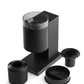 Black coffee grinder with attachments on a white background