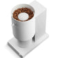 White coffee grinder with coffee beans on a white background