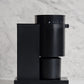 Black all-purpose coffee grinder on a marble surface