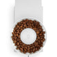 White coffee grinder filled with coffee beans on a white background