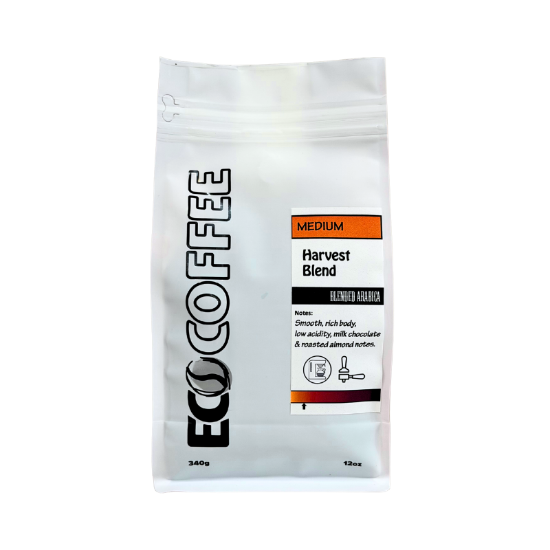 A 12oz stand-up pouch of Eco Coffee Medium Harvest Blend Blended Arabica coffee, shown on a plain white background.