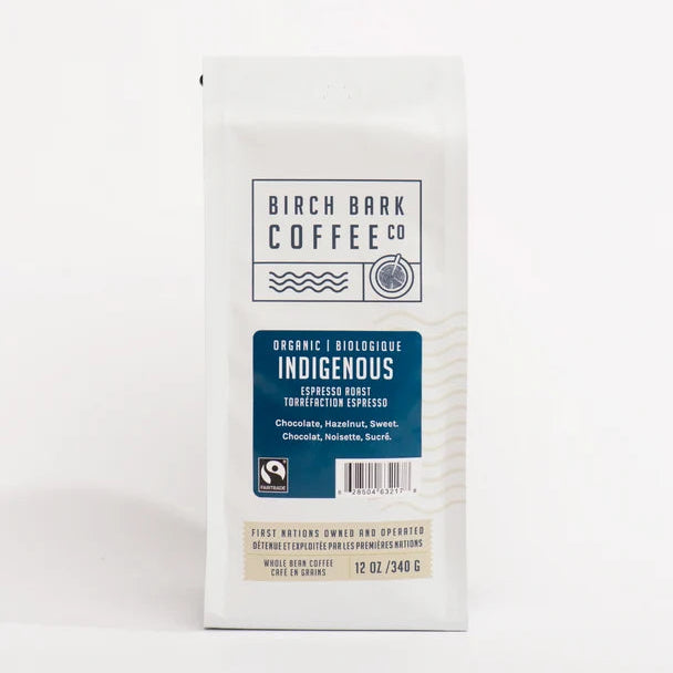 A 12 oz bag of Birch Bark Coffee Co. Indigenous Organic Espresso Roast coffee, shown in its white packaging with a blue label on a clean white background.