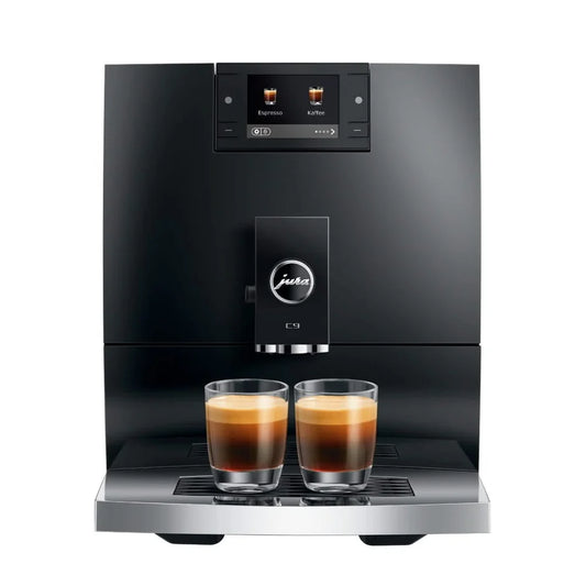 Black coffee machine with two glasses of coffee on a white background