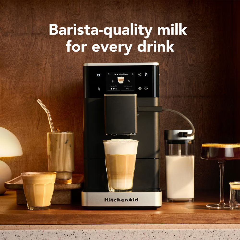 KitchenAid coffee machine with a cup of coffee and milk, text 'Barista-quality milk for every drink'.