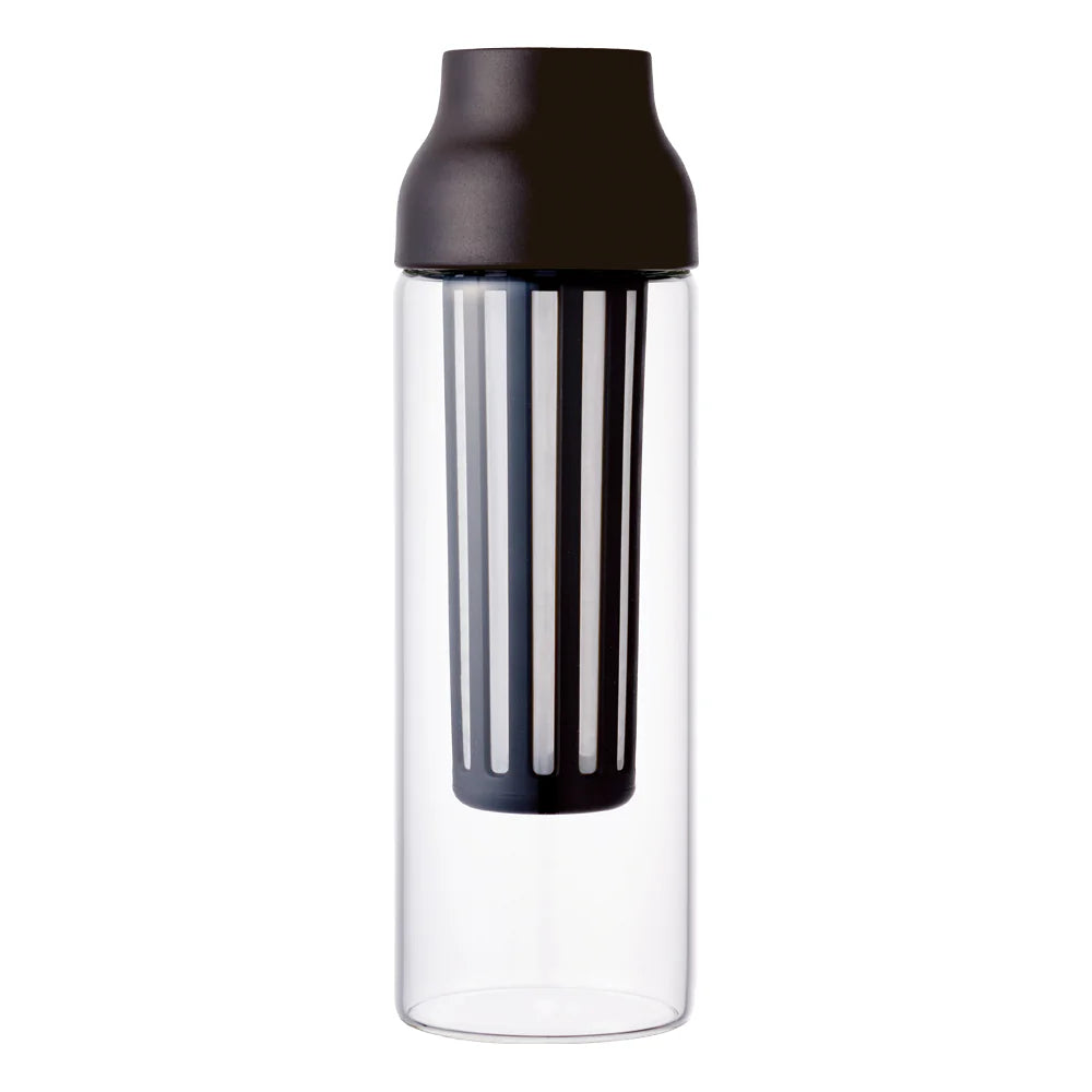 A clear glass carafe with a matte brown lid and a black vertical infuser strainer inside, shown on a solid white background.