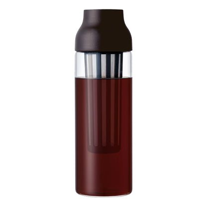 A tall, cylindrical glass bottle with a dark brown cap and a clear upper section, filled with coffee, shown on a plain white background.