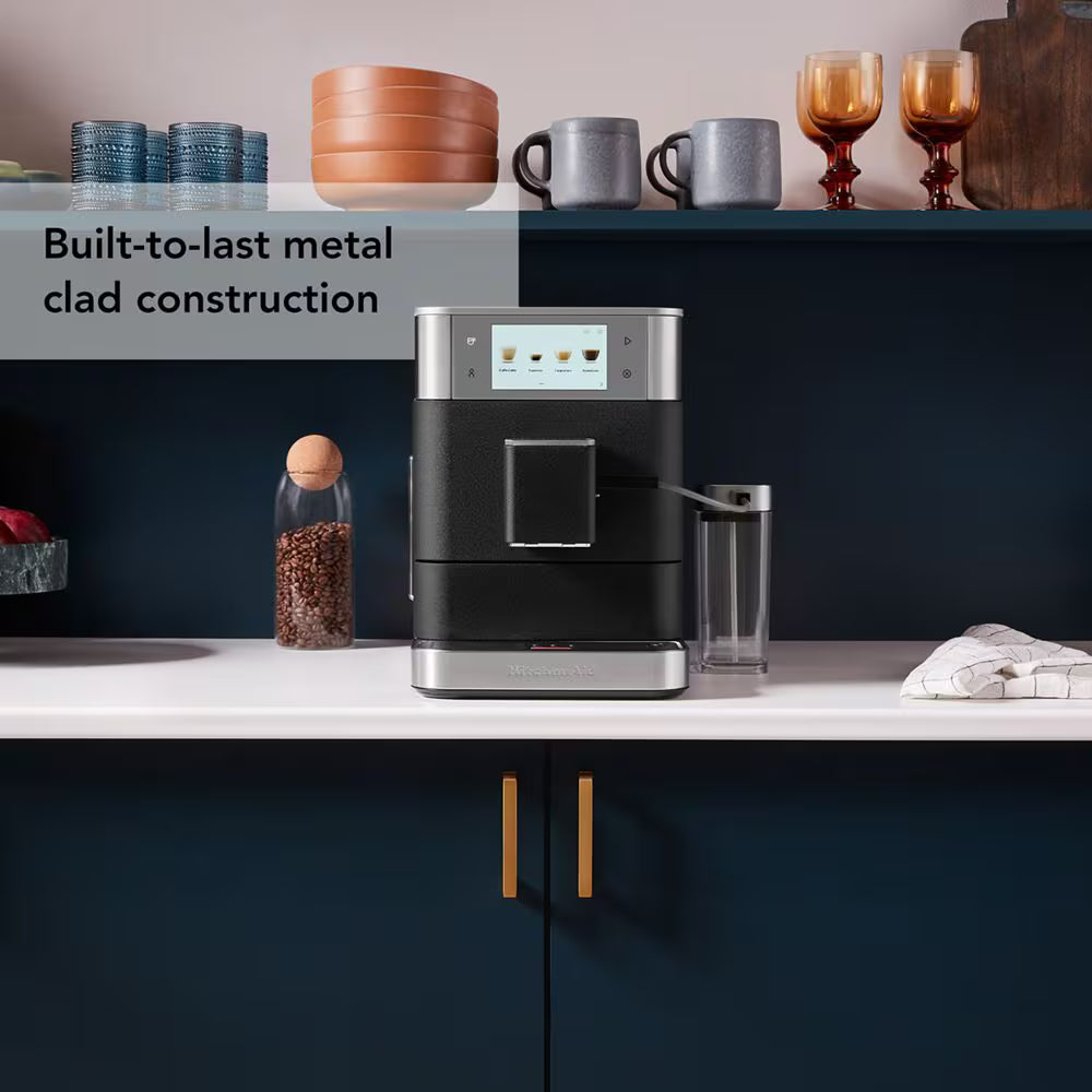 Modern coffee machine on a kitchen counter with text about metal clad construction.