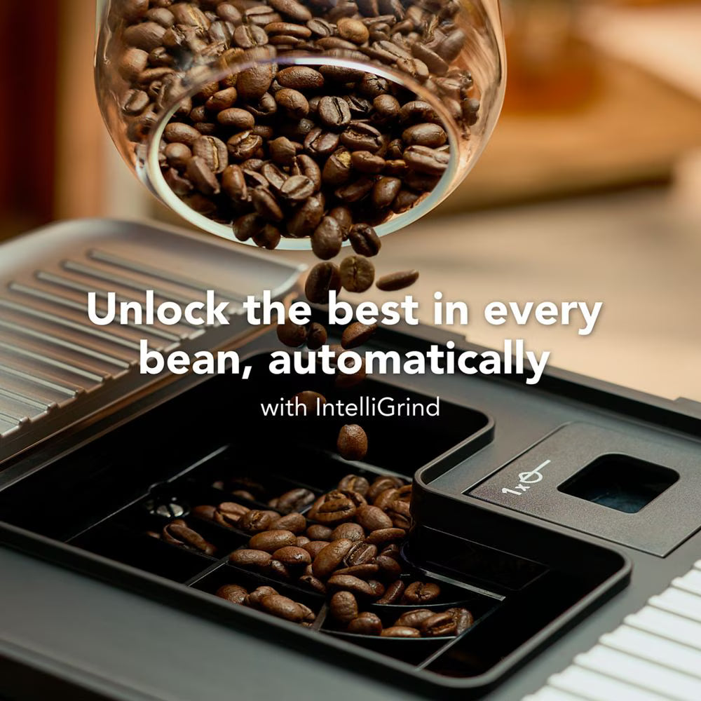 Coffee beans being poured into a black coffee grinder hopper with white text "Unlock the best in every bean, automatically with IntelliGrind".