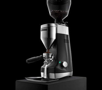 Mazzer Kony Sg commercial grinder grinding into portafilter 