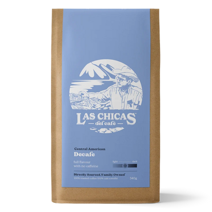 A 340g bag of Las Chicas del cafe Decaf coffee in a brown kraft paper bag with a light blue label and white graphic.