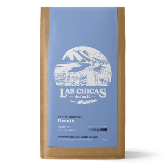 A 340g bag of Las Chicas del cafe Decaf coffee in a brown kraft paper bag with a light blue label and white graphic.