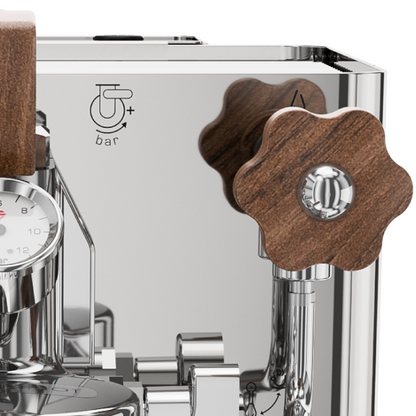 Close-up of a coffee machine with wooden handles and metallic components.