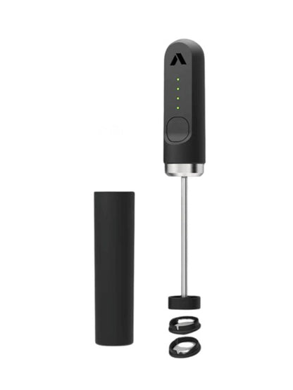 Black handheld milk frother with attachments on a white background