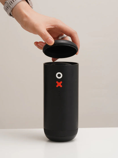 Black container with a red 'X' symbol on a beige background