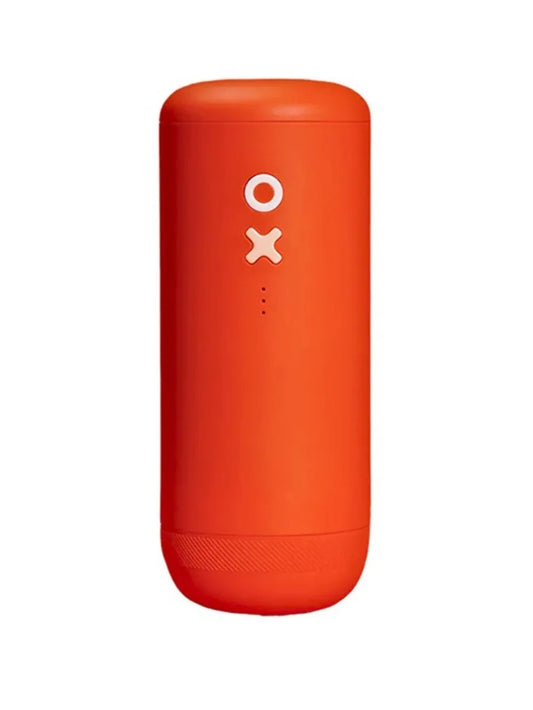 A bright orange coffee grinder with a matte finish, featuring a white power icon and a small LED indicator on the front, set against a plain white background.
