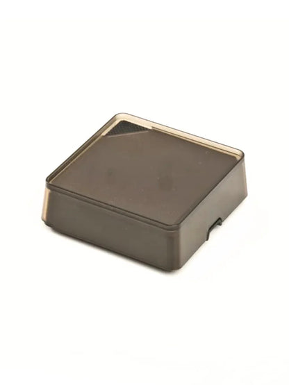 Square coffee scale with plastic cover sitting on a white background