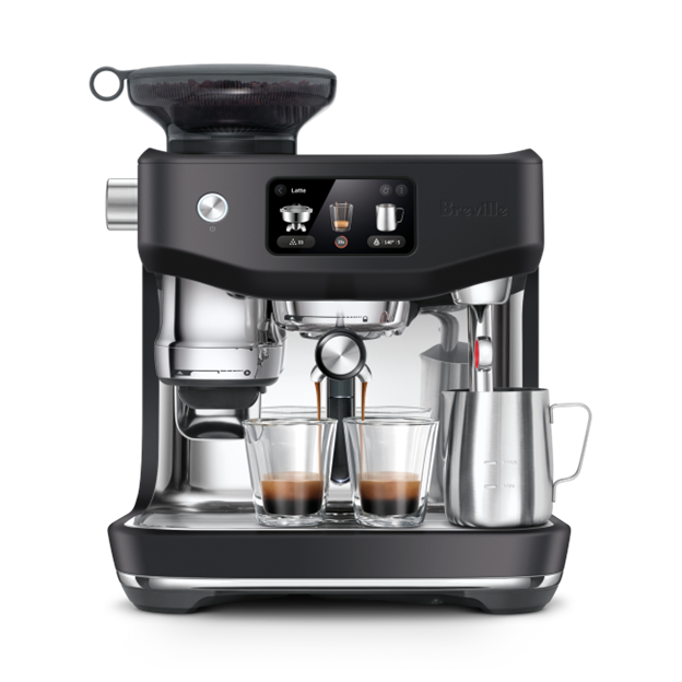 Breville Oracle Jet Black Truffle coffee machine with two glasses of coffee on a white background