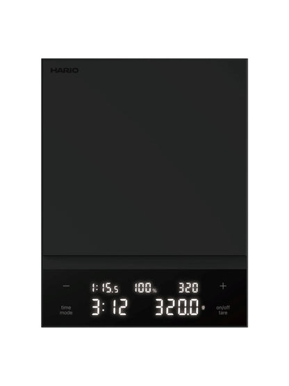 Black Hario coffee scale top view on a white background
