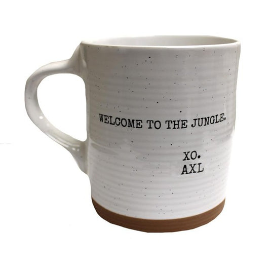 White mug with speckled texture and text 'Welcome to the Jungle. XO. AXL' on a white background